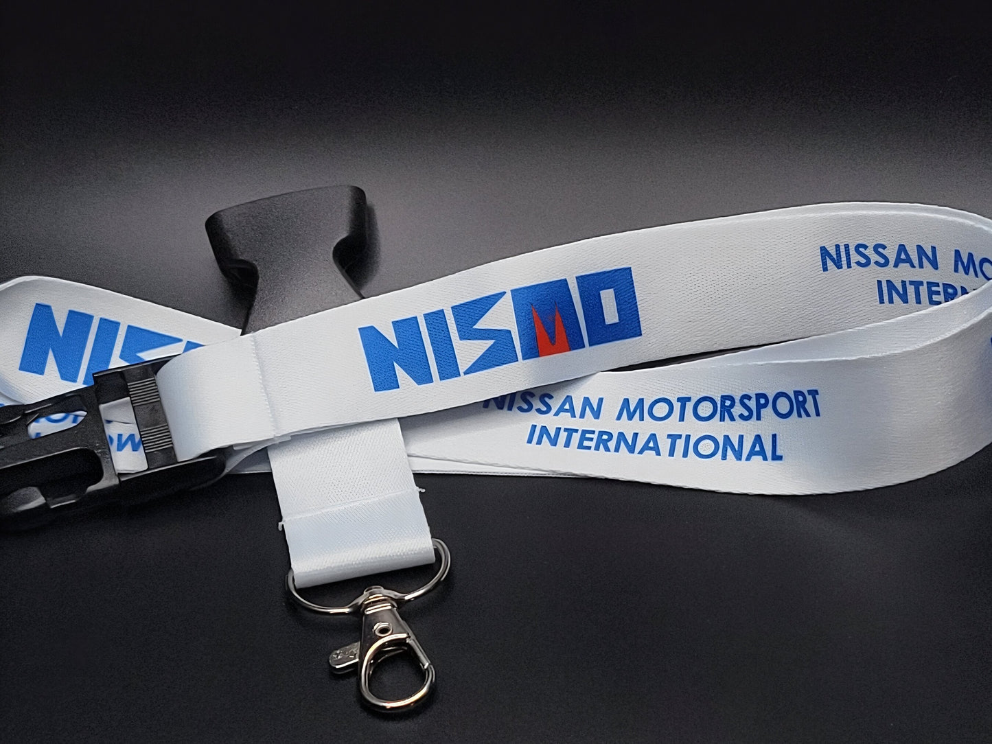 Nissan lanyard featuring the original NISMO logo.