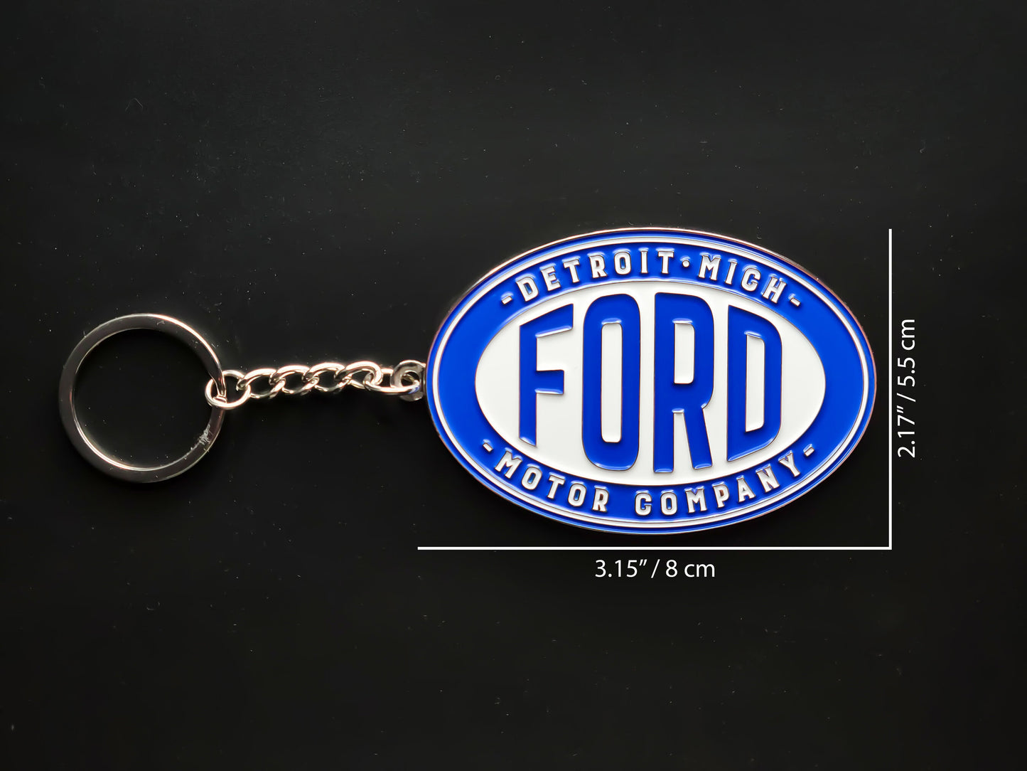 Dimension shot of the Ford Motor Company badge keychain showing a size of 3.15 inches by 2.17 inches (8 cm by 5.5 cm).