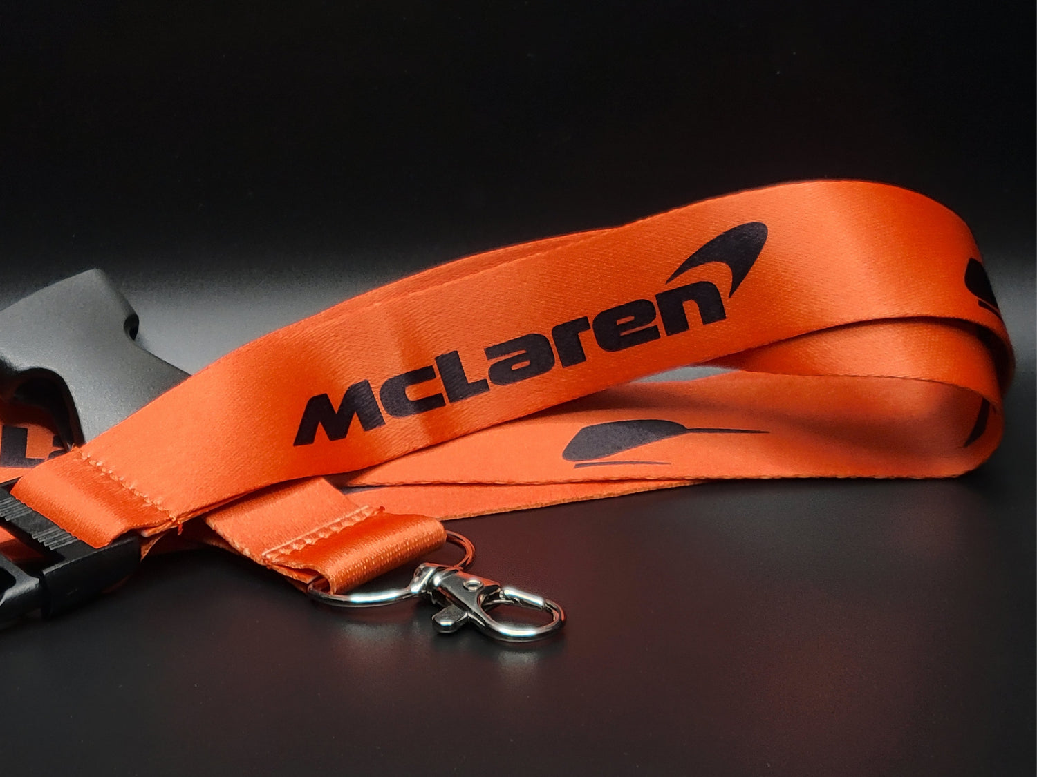McLaren lanyard featuring the iconic McLaren Speedy Kiwi logo.