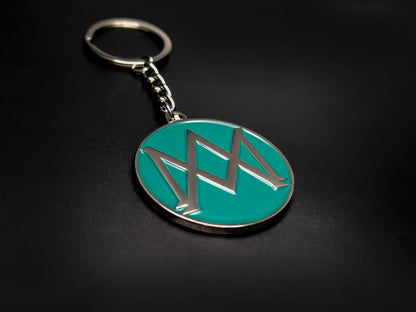 High-quality Aston Martin heritage keychain on a dark background, showcasing the polished silver-tone finish and durable linked chain.