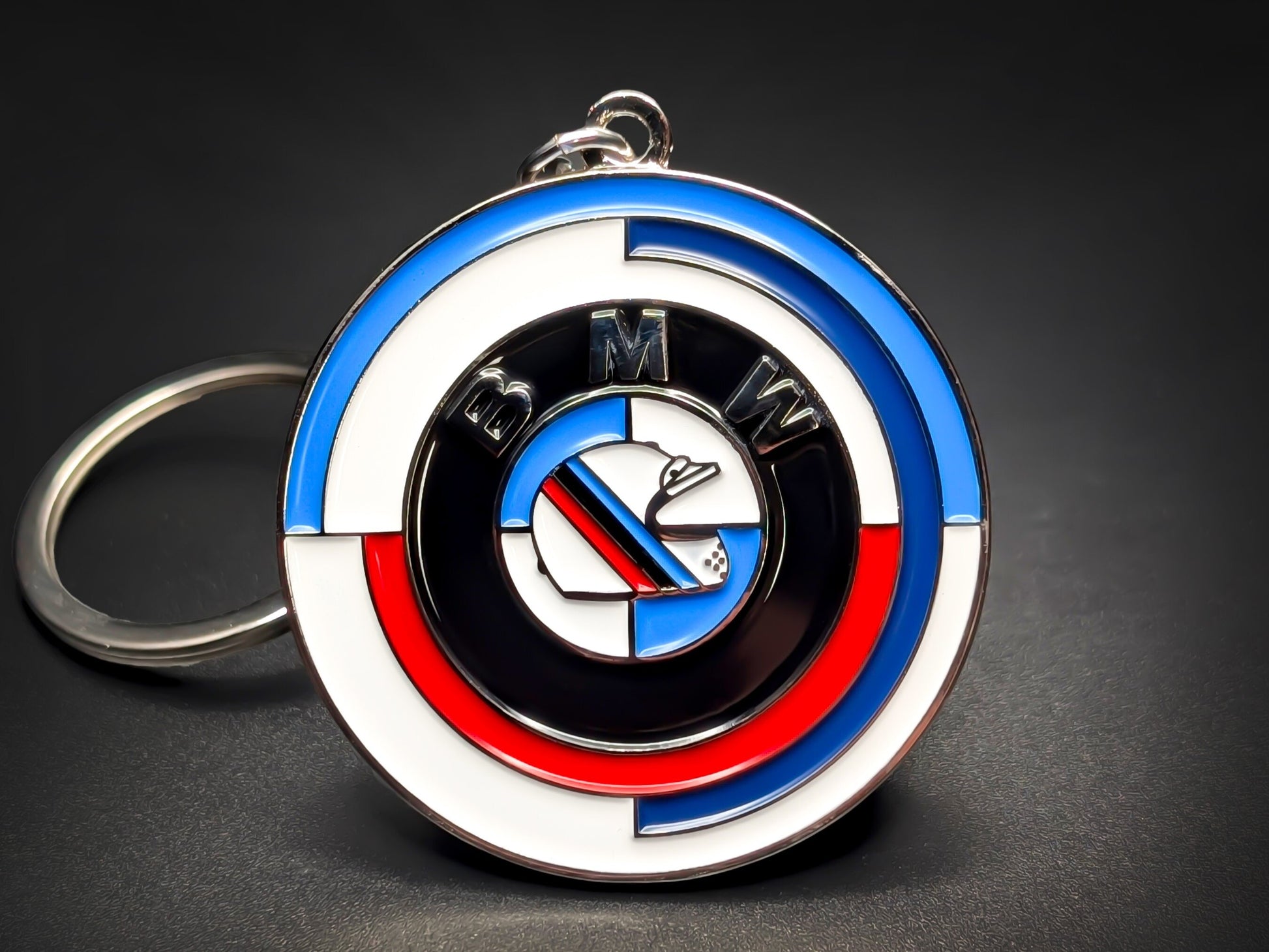 BMW 50th Anniversary Heritage badge keychain with classic blue, violet, and red M-Performance circular enamel design.