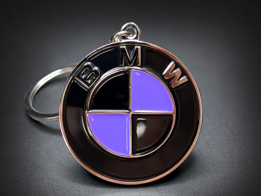 Custom BMW badge keychain featuring a vibrant purple and black enamel roundel with polished silver "BMW" lettering.