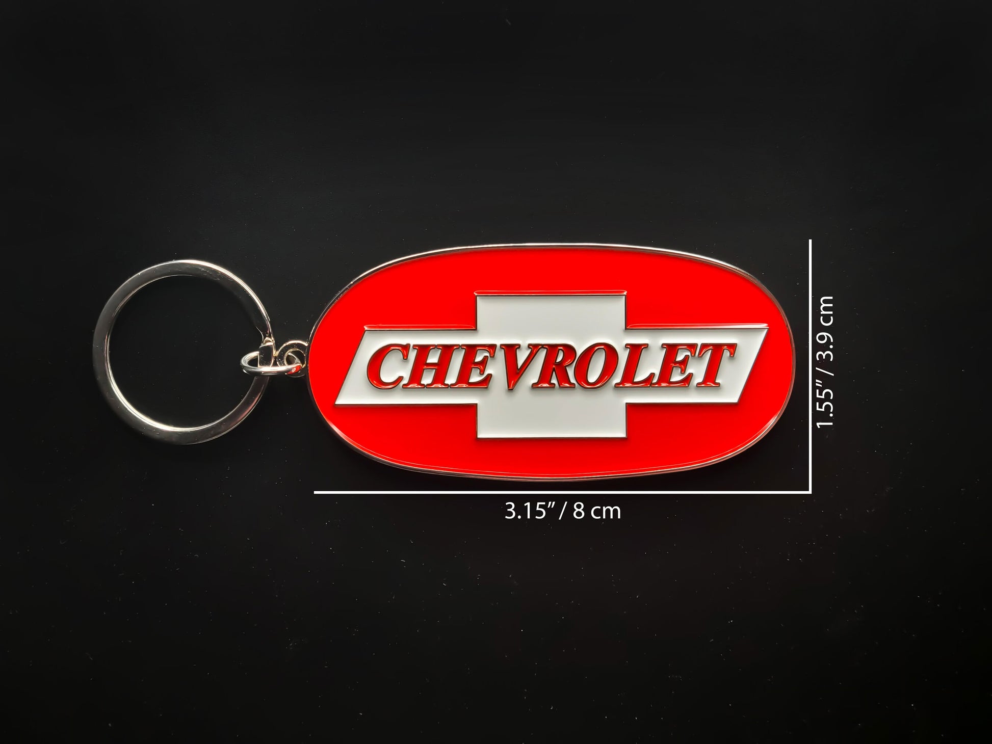 Dimension shot of the Chevy Trucks badge keychain showing a size of 3.15 inches by 1.55 inches (8 cm by 3.9 cm).