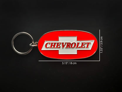 Dimension shot of the Chevy Trucks badge keychain showing a size of 3.15 inches by 1.55 inches (8 cm by 3.9 cm).