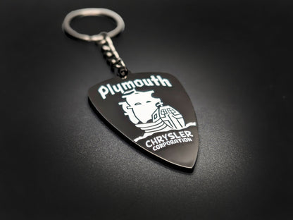 High-quality Plymouth heritage badge keychain on a dark background, showing the polished gunmetal chain and glossy finish.