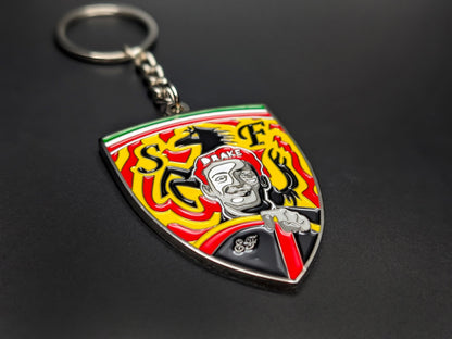 High-quality Enzo Ferrari tribute keychain on a dark background, showing the polished silver-tone trim and Italian tricolor top detail.