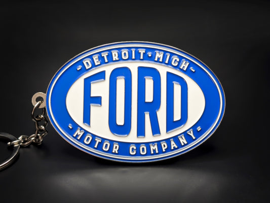 Vintage Ford Motor Company oval badge keychain with blue and white enamel featuring "Detroit, Mich." and "Motor Company" text.