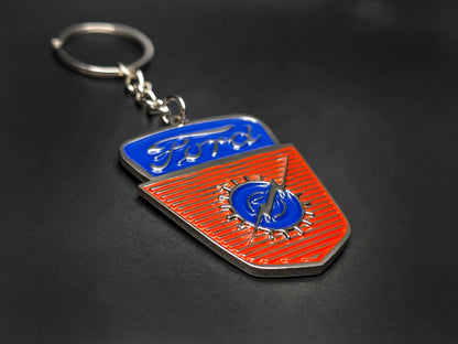 High-quality retro Ford F-100 heritage keychain on a dark background, showcasing the glossy enamel finish and sturdy silver link chain.