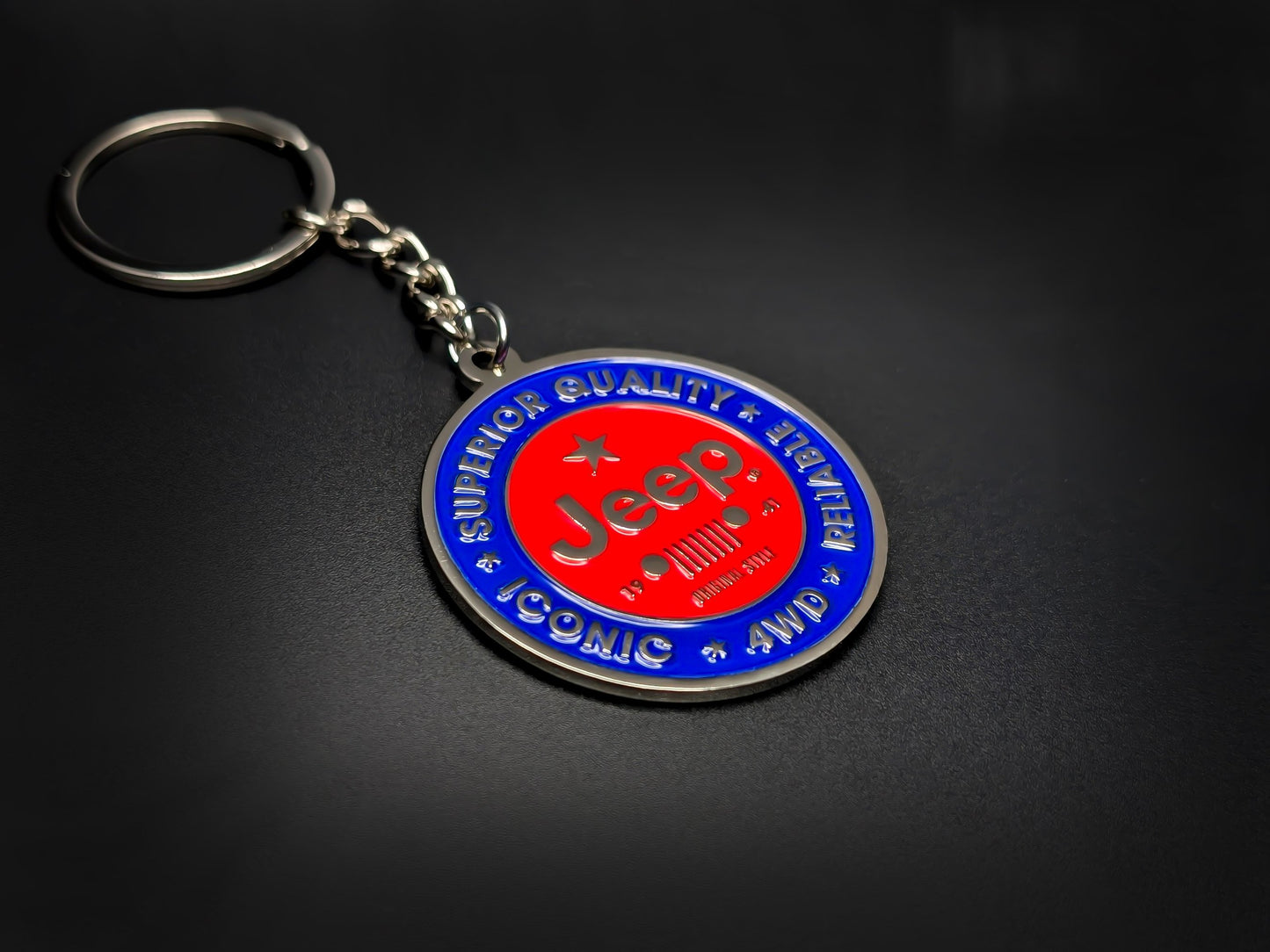 High-quality Jeep off-road keychain on a dark background, showcasing the polished silver-tone metal and durable linked chain.