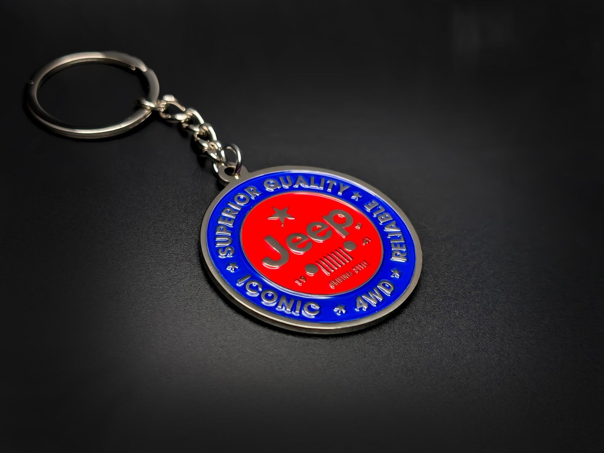 High-quality Jeep off-road keychain on a dark background, showcasing the polished silver-tone metal and durable linked chain.