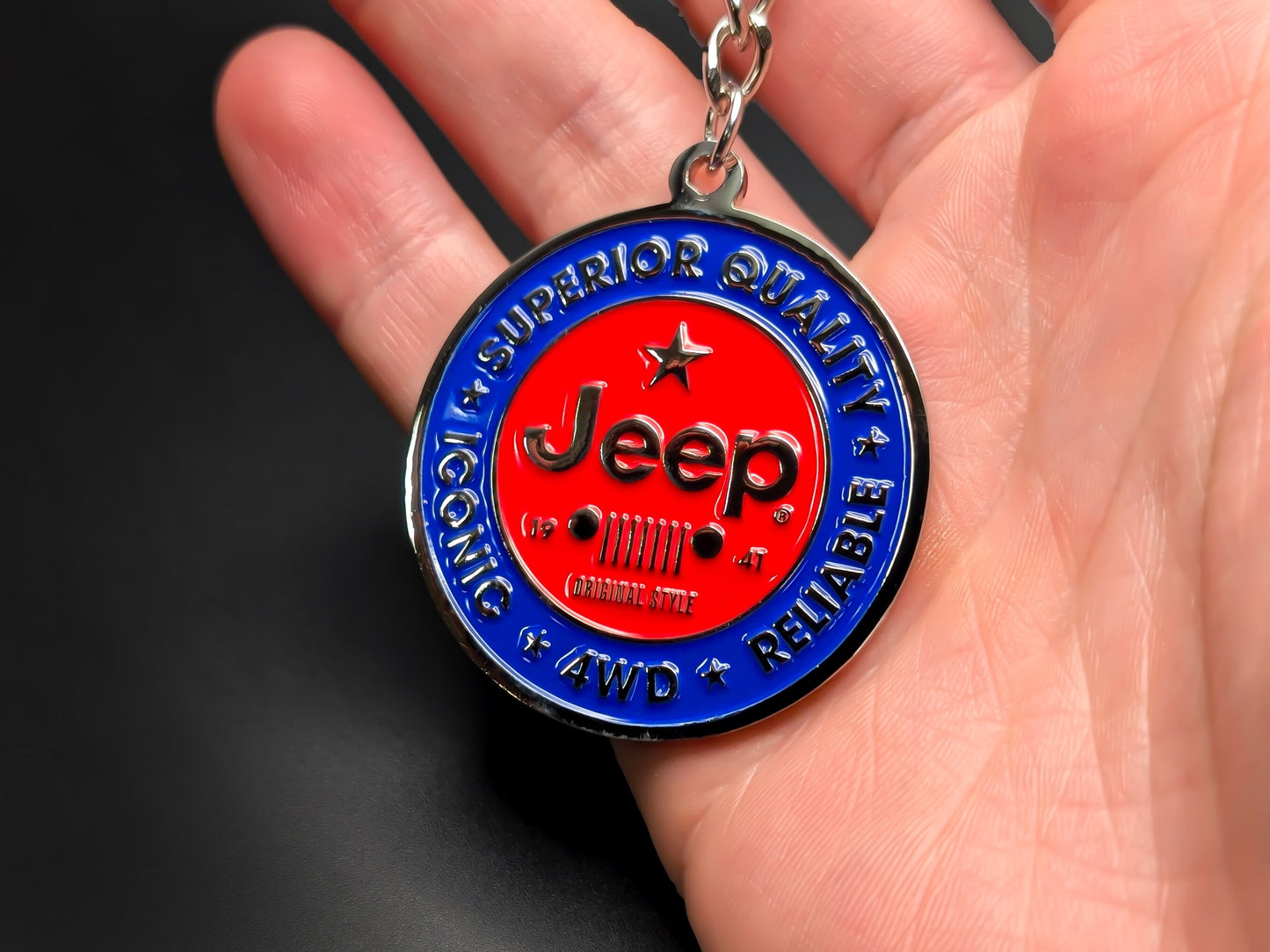 High-quality Jeep off-road keychain on a dark background, showcasing the polished silver-tone metal and durable linked chain.