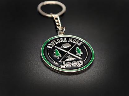 High-quality Jeep adventure keychain on a dark surface, showcasing the polished silver-tone metal and durable linked chain.