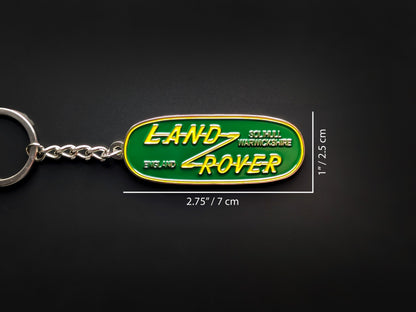 Dimension shot of the Land Rover badge keychain measuring 2.75 inches by 1 inch (7 cm by 2.5 cm).