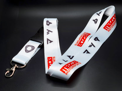 Premium Mazda JDM neck lanyard with a repeating pattern of racing logos and rotary engine symbols on a crisp white background.