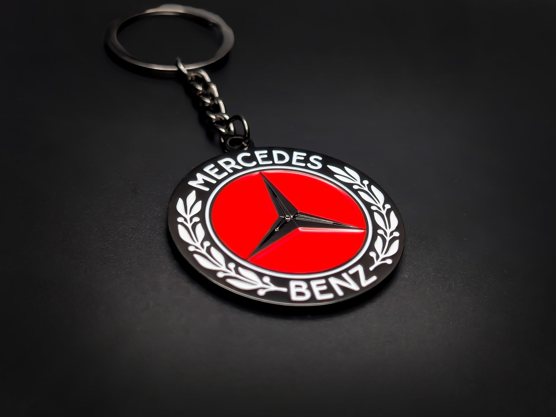 High-gloss Mercedes-Benz car club badge keychain on a dark background, showcasing the polished silver-tone chain and heavy-duty metal base.