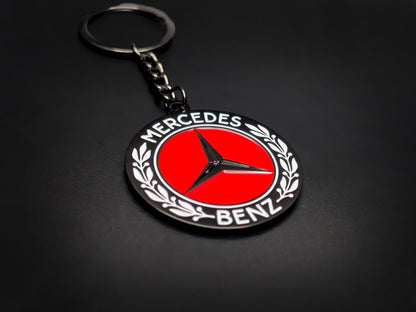 High-gloss Mercedes-Benz car club badge keychain on a dark background, showcasing the polished silver-tone chain and heavy-duty metal base.