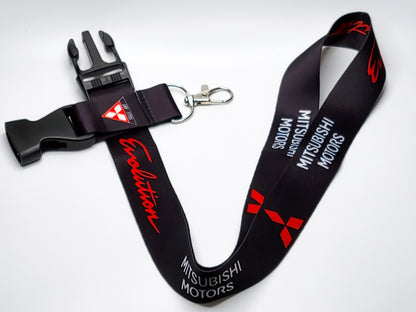 Full layout of a Mitsubishi EVO JDM lanyard with its black quick-release plastic buckle, Ralliart branding, and durable silver key attachment.